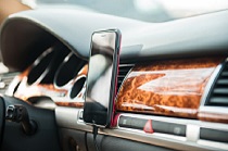 Cell phone on car dashboard